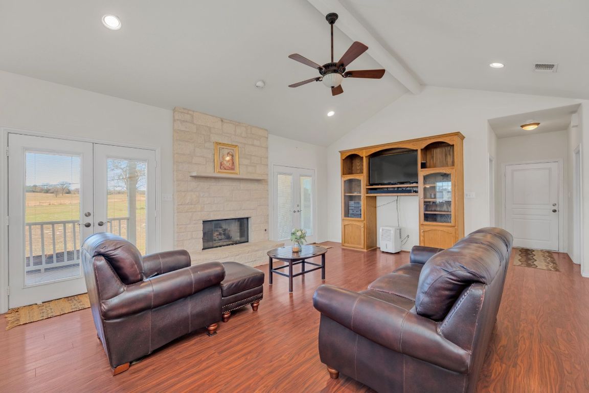 1949 Farm To Market Road 619 Elgin, TX 78621 - Photo 7 of 36 a living room with furniture and a fireplace