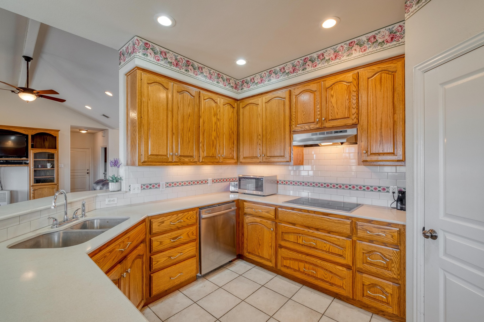 1949 Farm To Market Road 619 Elgin, TX 78621 - Photo 7 of 32 a kitchen with a sink stove and cabinets