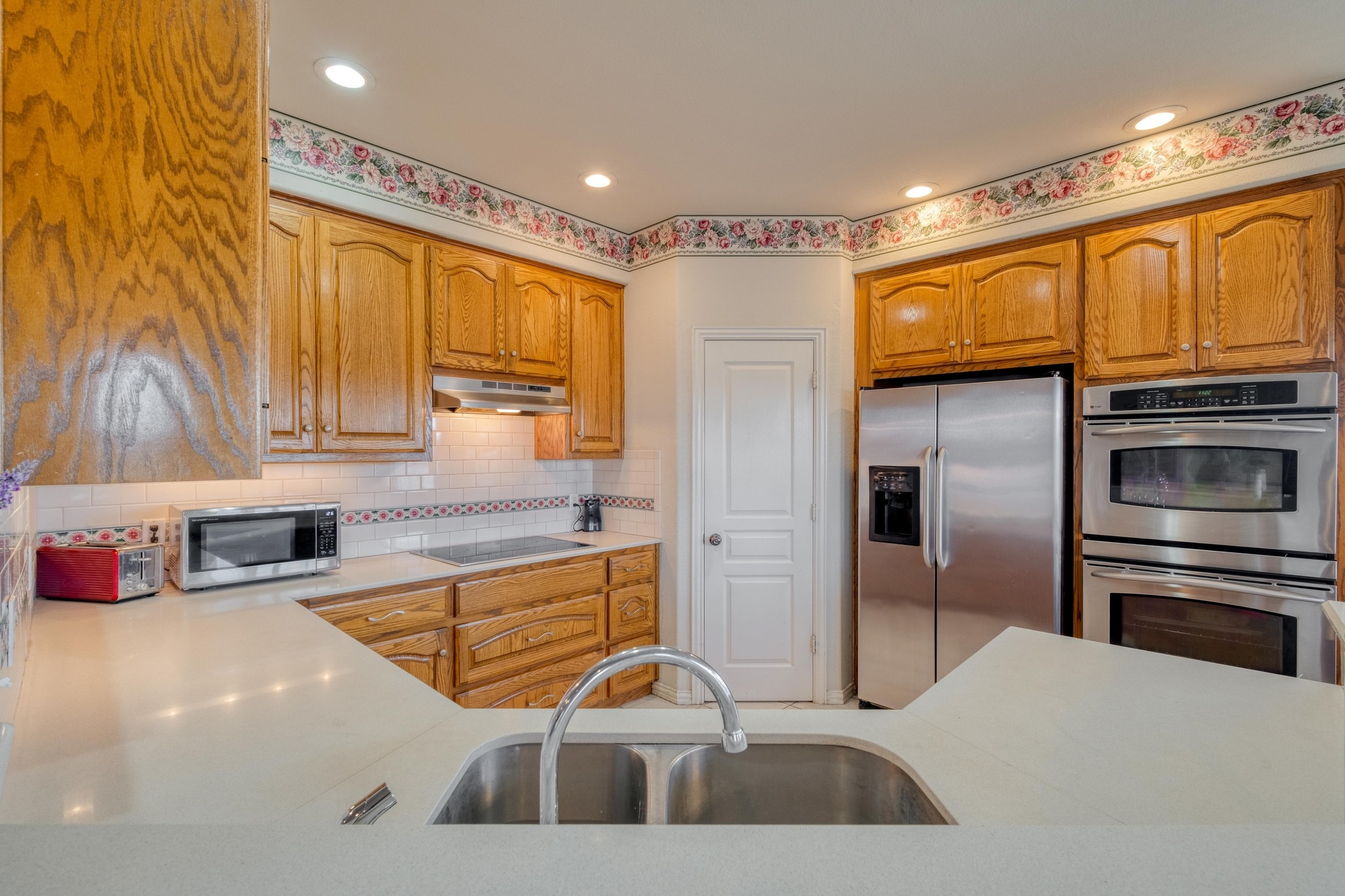 1949 Farm To Market Road 619 Elgin, TX 78621 - Photo 8 of 32 a kitchen with stainless steel appliances a sink a stove and a refrigerator