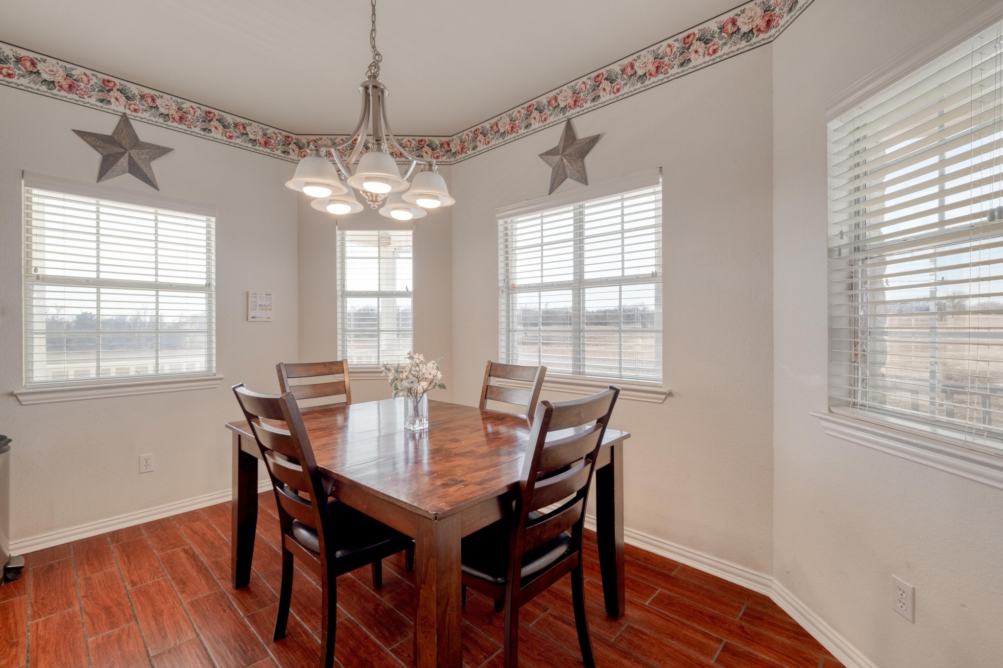 1949 Farm To Market Road 619 Elgin, TX 78621 - Photo 10 of 32 a view of a dining room with furniture window and wooden floor