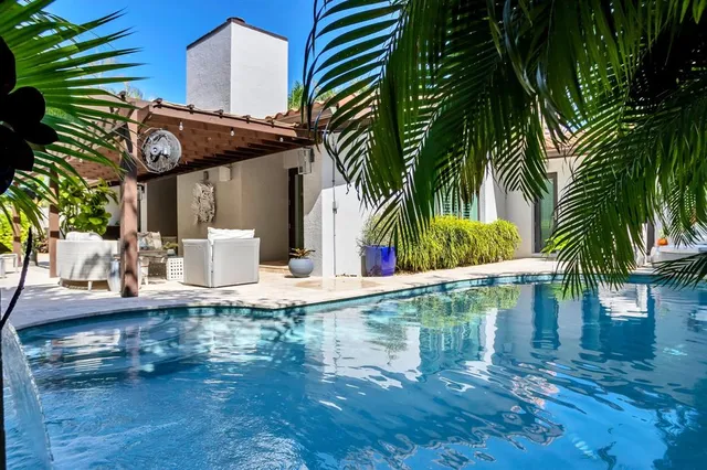 a view of a palm trees in front of a house
