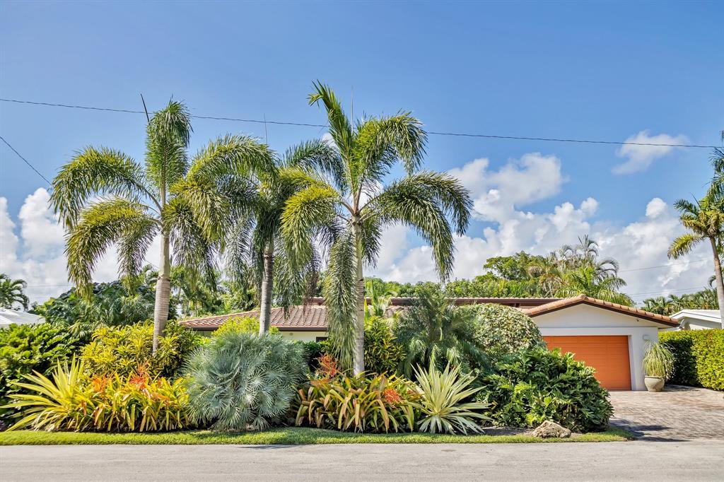 2013 Northeast 32nd Avenue Fort Lauderdale, FL 33305 - Photo 2 of 50 a view of a palm trees in front of a house