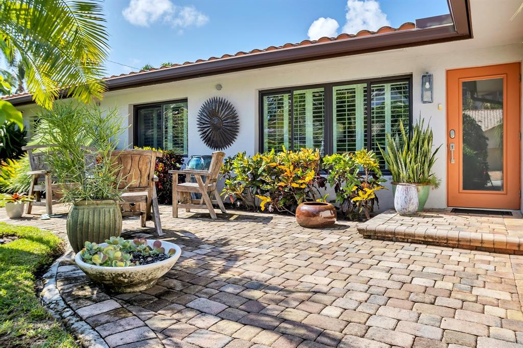 2013 Northeast 32nd Avenue Fort Lauderdale, FL 33305 - Photo 3 of 50 a view of a backyard with plants and a patio