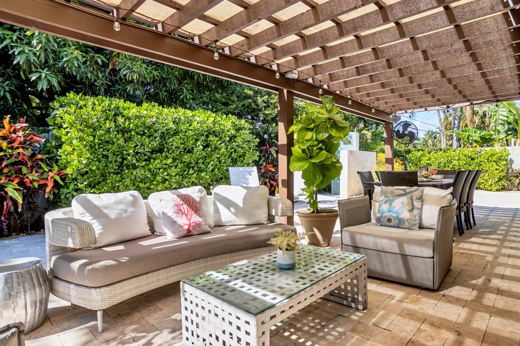 2013 Northeast 32nd Avenue Fort Lauderdale, FL 33305 - Photo 5 of 50 a outdoor living space with furniture and garden view