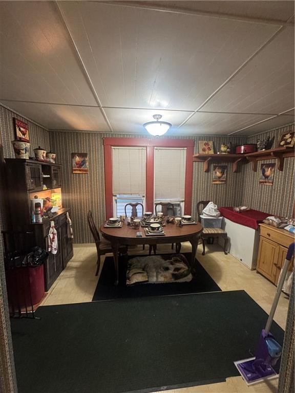 444 East Washington Street Rochester, PA 15074 - Photo 15 of 33 a living room with furniture a flat screen tv and a large window
