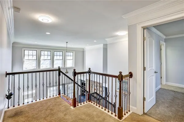 a view of hallway with windows