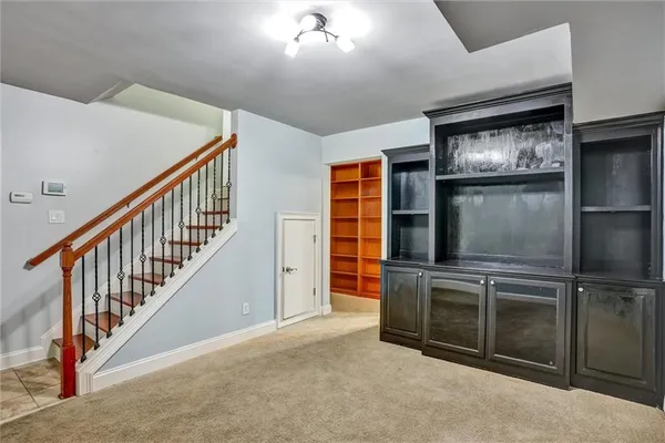 a view of a hallway with stairs