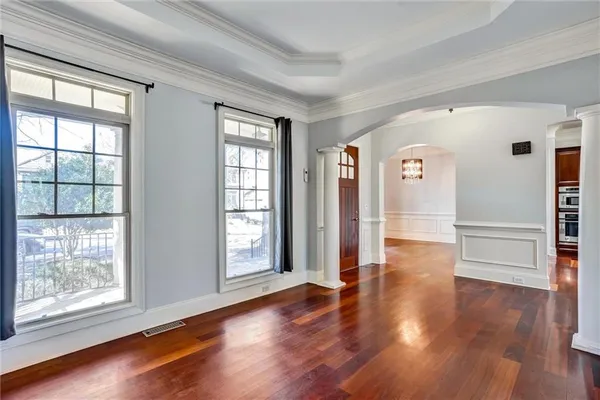 wooden floor in an empty room with a window