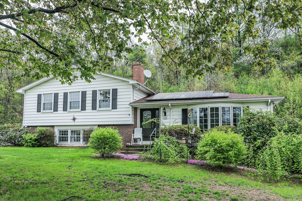 105 Gilbertville Road Ware, MA 01082 - Photo 1 of 41 a front view of a house with a yard and potted plants