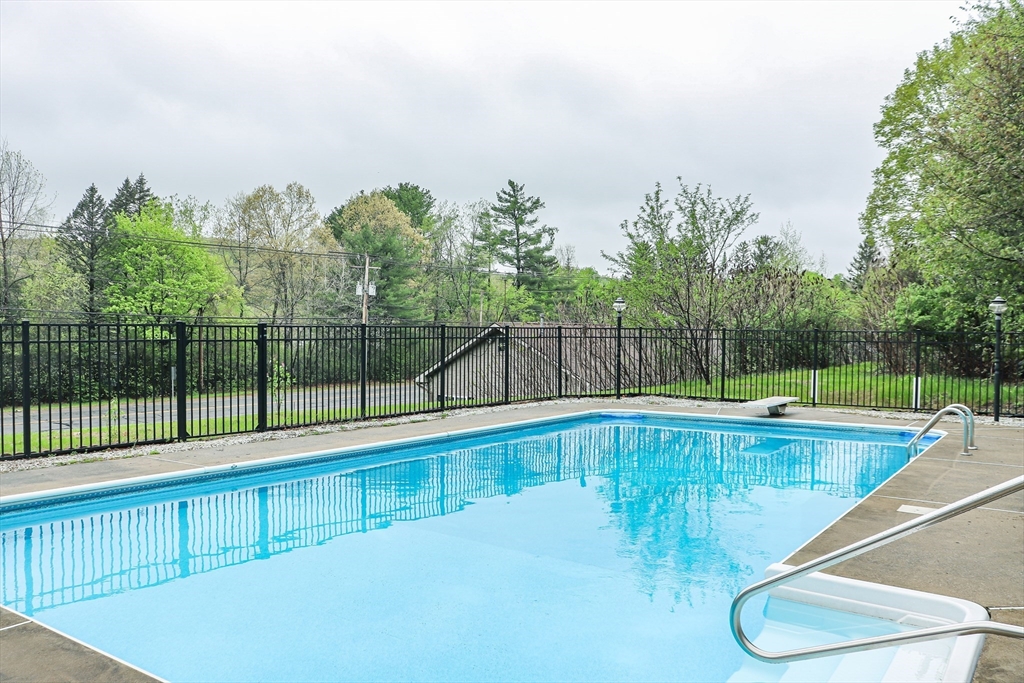 105 Gilbertville Road Ware, MA 01082 - Photo 2 of 41 a view of a swimming pool with a yard and sitting area