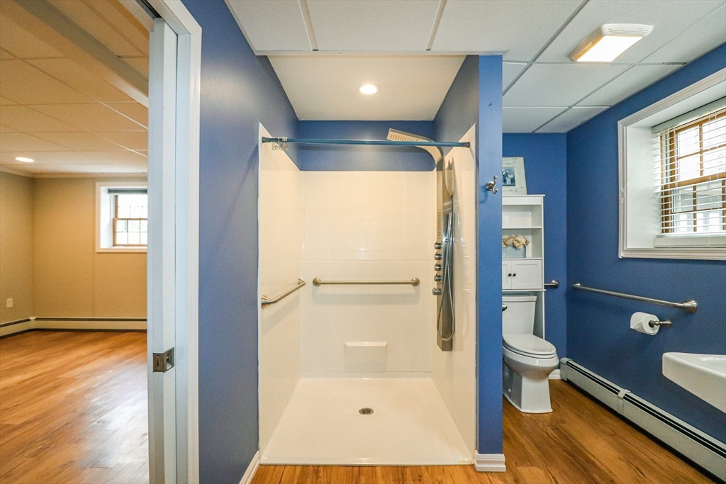 105 Gilbertville Road Ware, MA 01082 - Photo 31 of 41 a bathroom with a glass shower door and a toilet