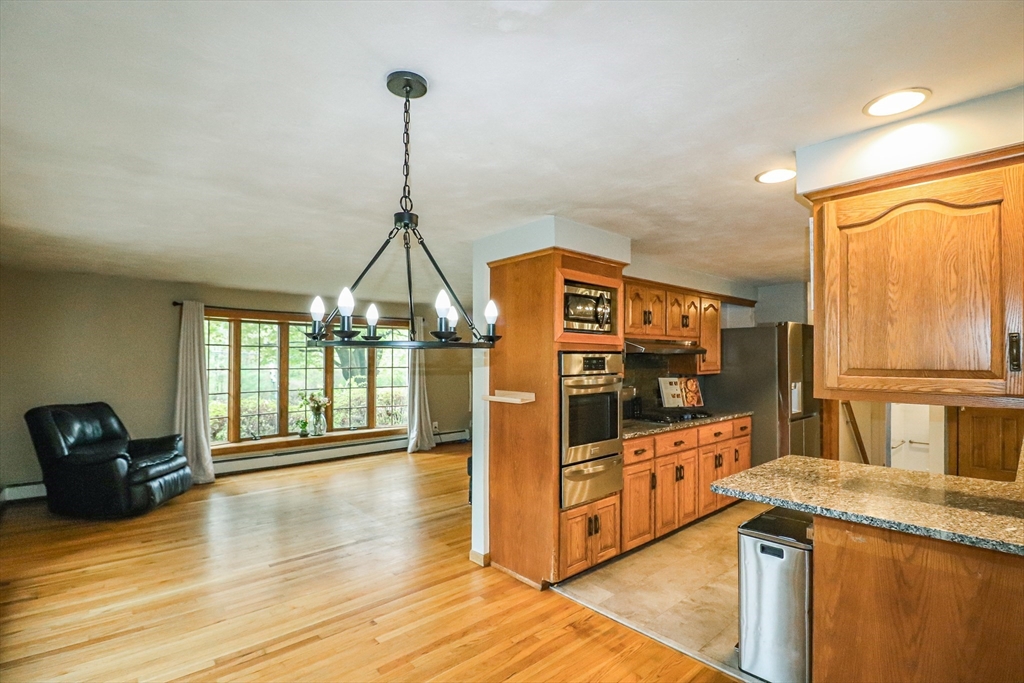 105 Gilbertville Road Ware, MA 01082 - Photo 10 of 41 a kitchen with stainless steel appliances granite countertop a stove and a wooden floors