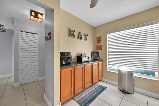 a kitchen with stainless steel appliances granite countertop a refrigerator and a stove