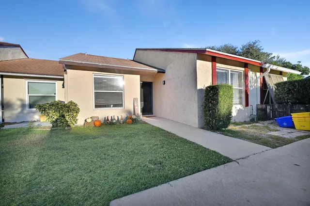 a front view of house with yard