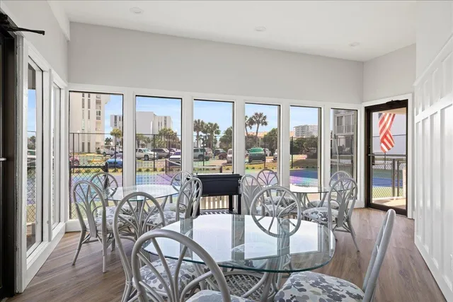 a very nice looking living room with furniture and floor to ceiling windows