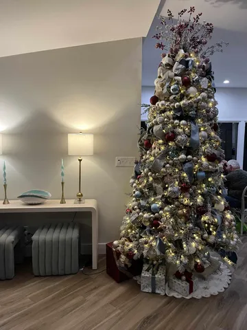 a room with a large entryway and chandelier