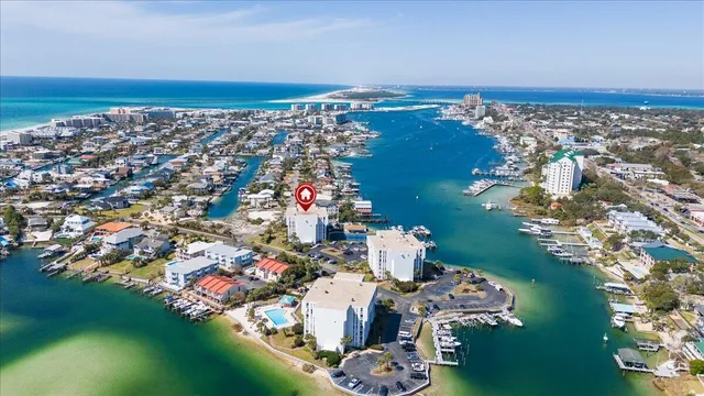 an aerial view of a house with a ocean view
