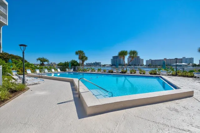a view of pool with outdoor seating