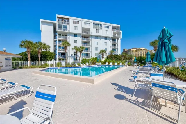 a view of swimming pool with a patio