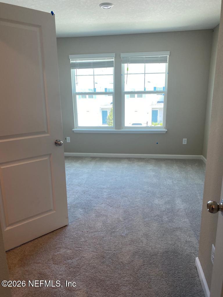 243 Boracay Circle St. Johns, FL 32259 - Photo 11 of 20 an empty room with windows