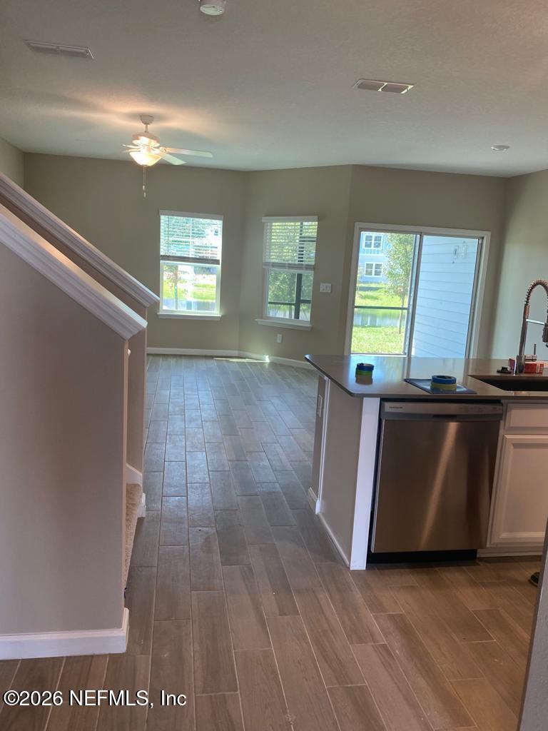 243 Boracay Circle St. Johns, FL 32259 - Photo 3 of 20 a view of kitchen and hall with wooden floor
