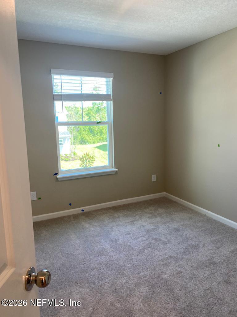 243 Boracay Circle St. Johns, FL 32259 - Photo 10 of 20 an empty room with a window