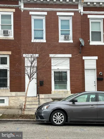 a front view of a house with parking