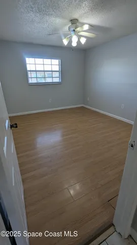 a bathroom with a toilet and a mirror