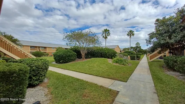 a view of pool with a yard