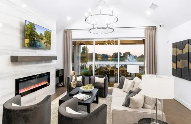 a living room with fireplace furniture and a fireplace