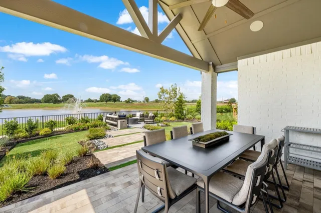 a view of a balcony with lake view and a table