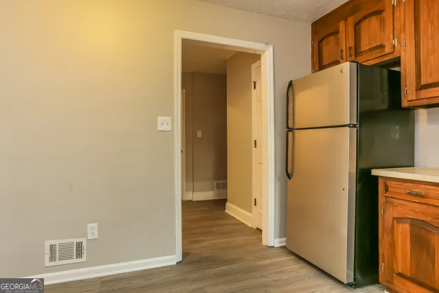 a view of a kitchen from the hallway