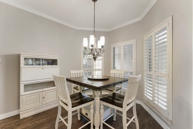 a view of a dining room with furniture and window