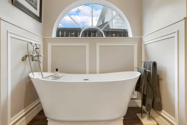 a white bath tub sitting in a bathroom