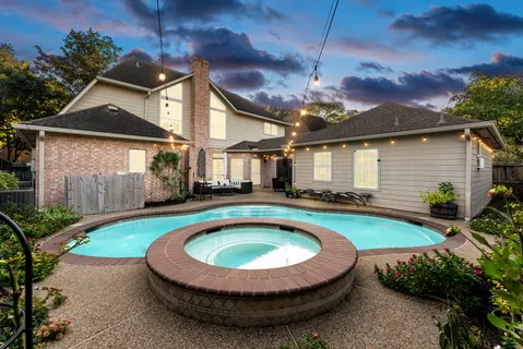 a view of a house with swimming pool