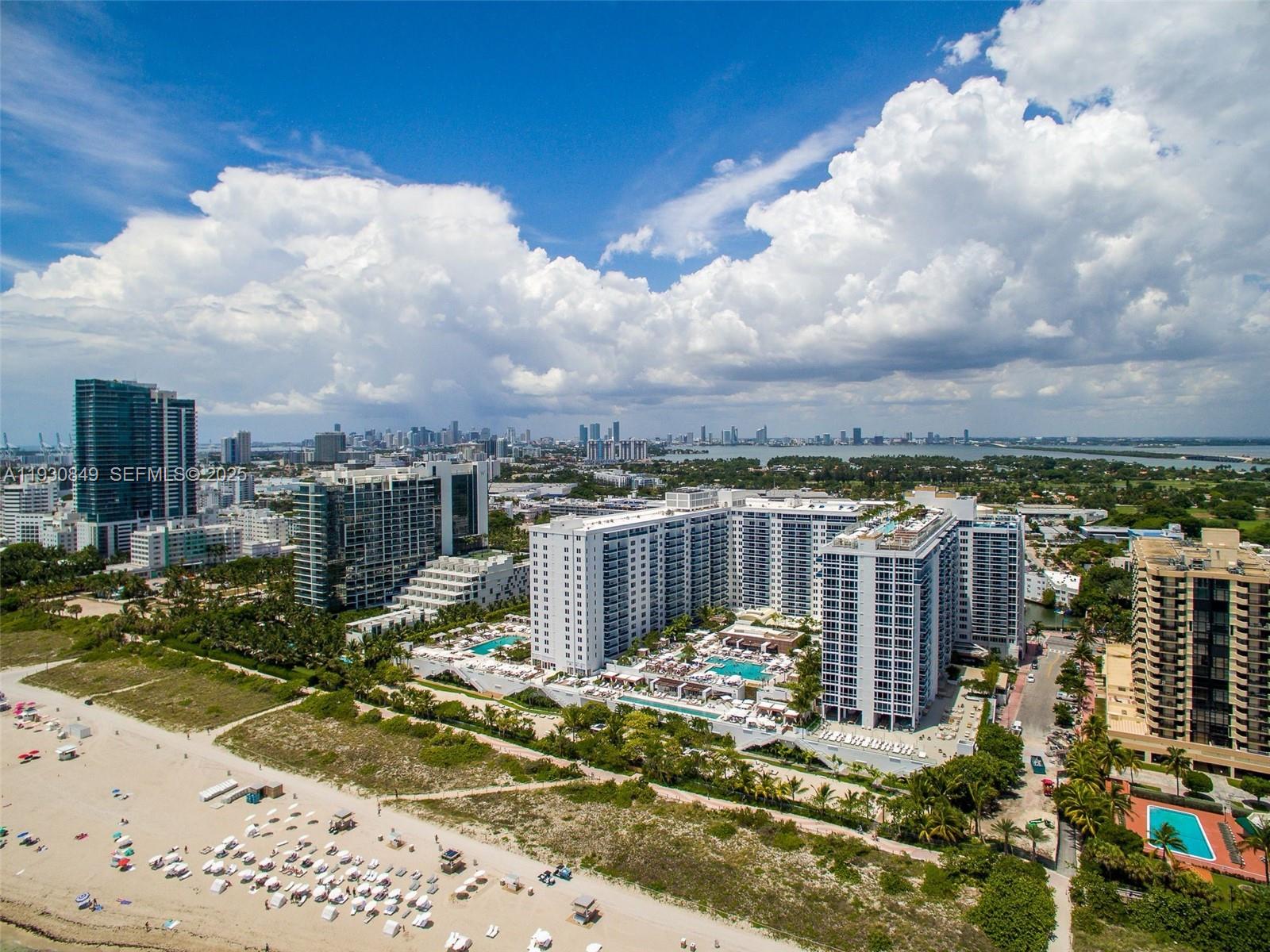 102 24th Street, Unit 1414 Miami Beach, FL 33139 - Photo 2 of 3 a view of a lake with a building in the background