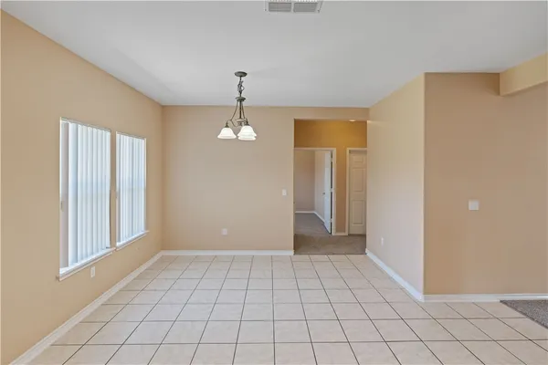 a view of an empty room and window in a room