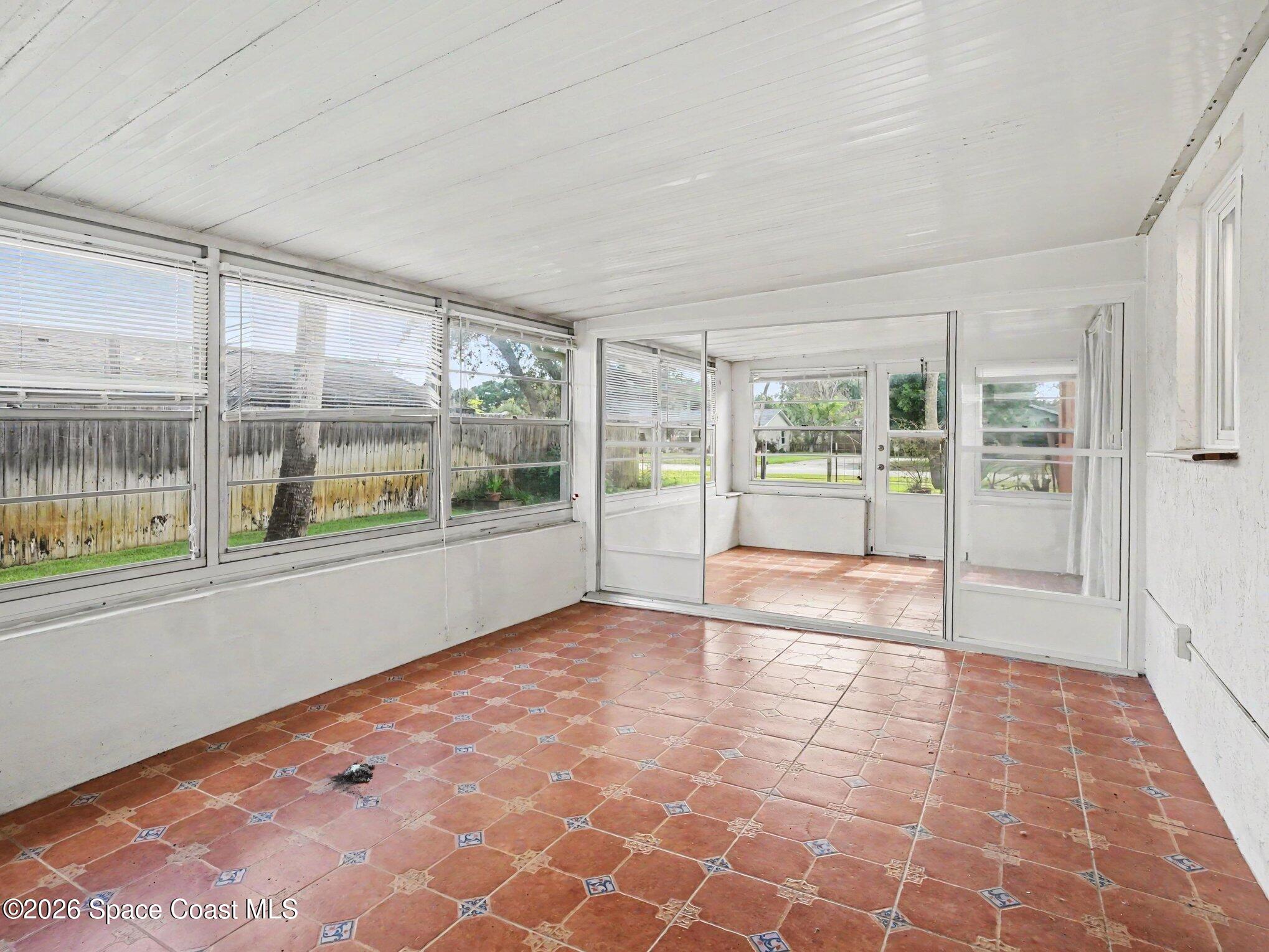 1870 Tallpalm Road Melbourne, FL 32935 - Photo 23 of 30 a view of empty room with wooden floor and fan
