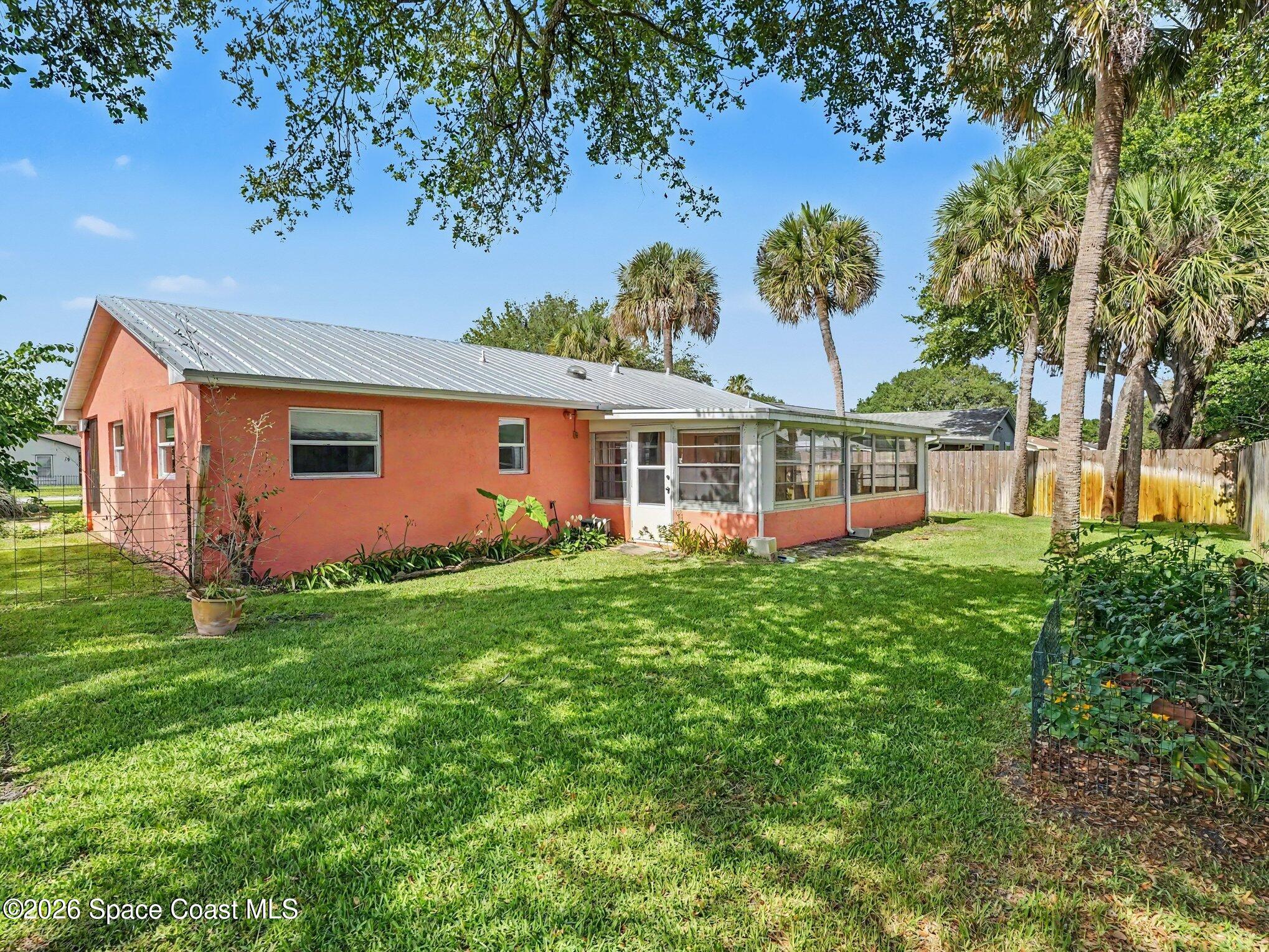 1870 Tallpalm Road Melbourne, FL 32935 - Photo 26 of 30 a front view of a house with garden