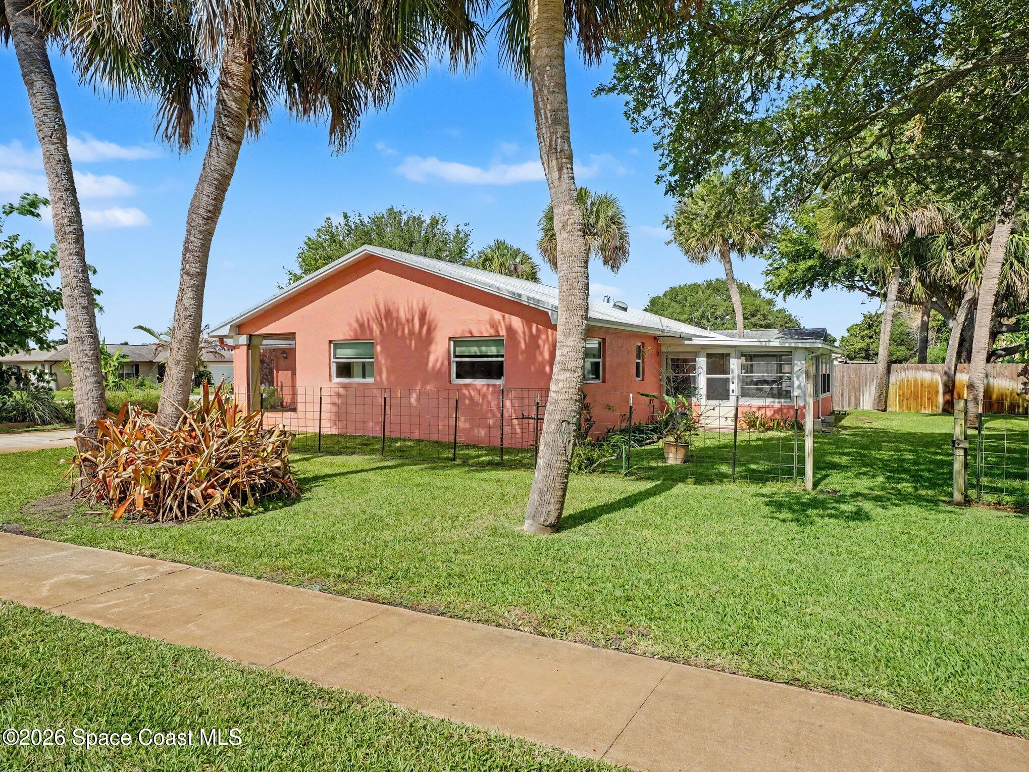 1870 Tallpalm Road Melbourne, FL 32935 - Photo 28 of 30 a front view of a house with garden
