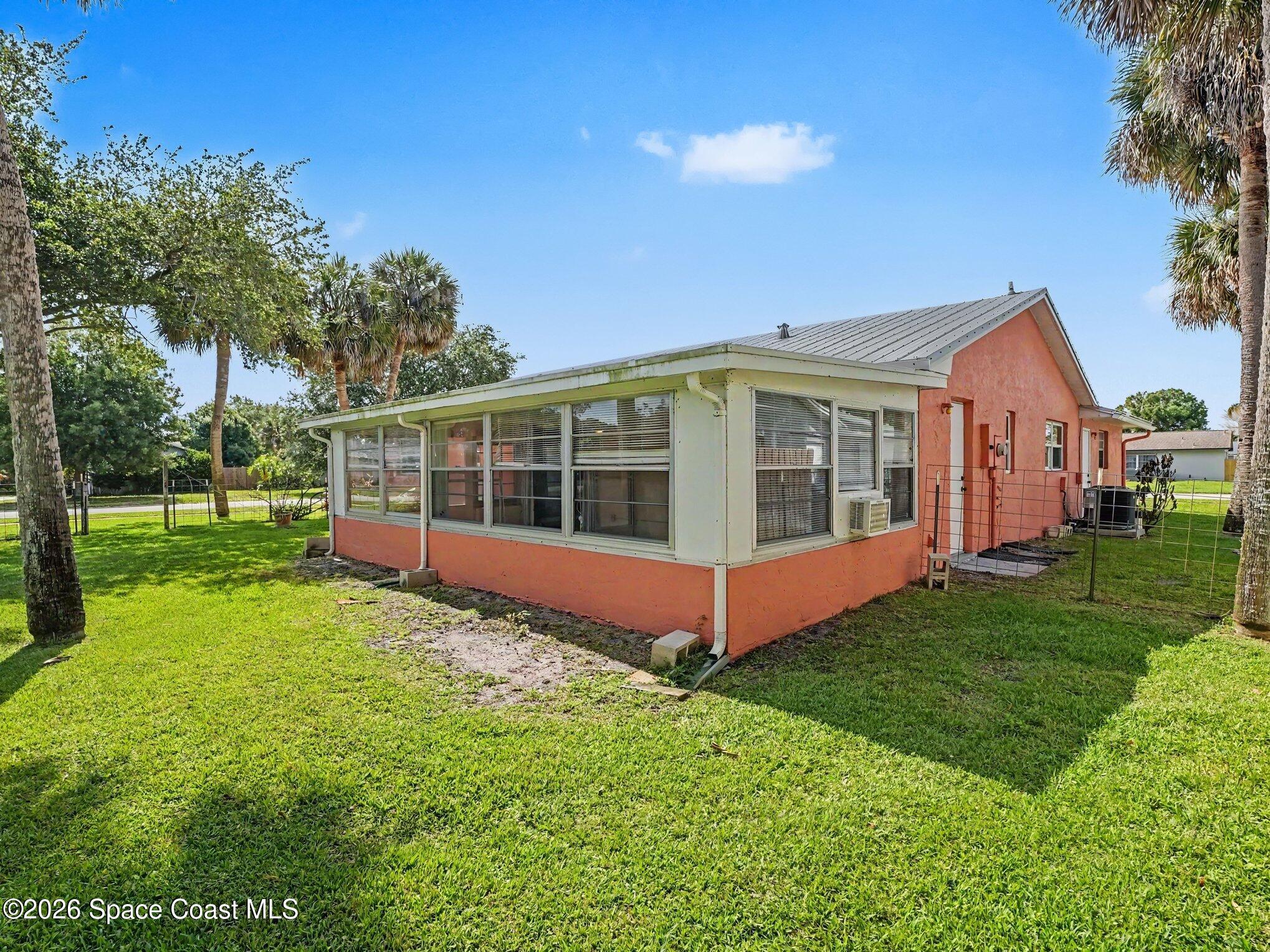 1870 Tallpalm Road Melbourne, FL 32935 - Photo 29 of 30 a view of a house with a big yard