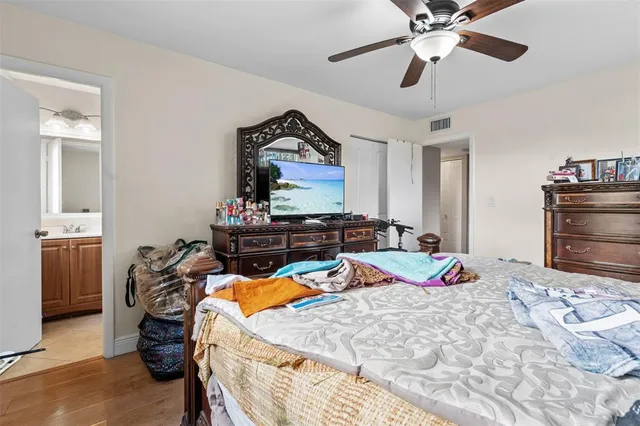 a bed room with a bed and a television