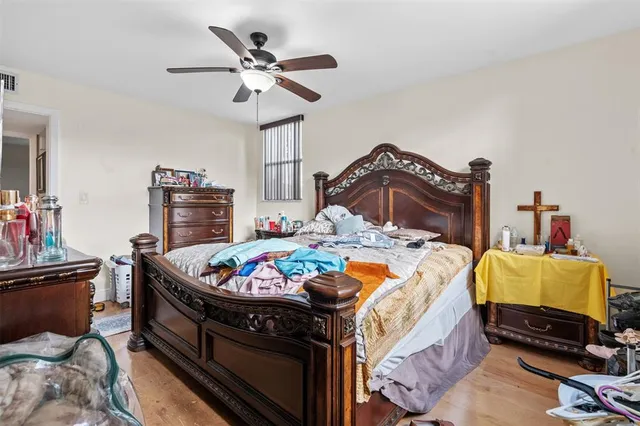 a bedroom with bed and window