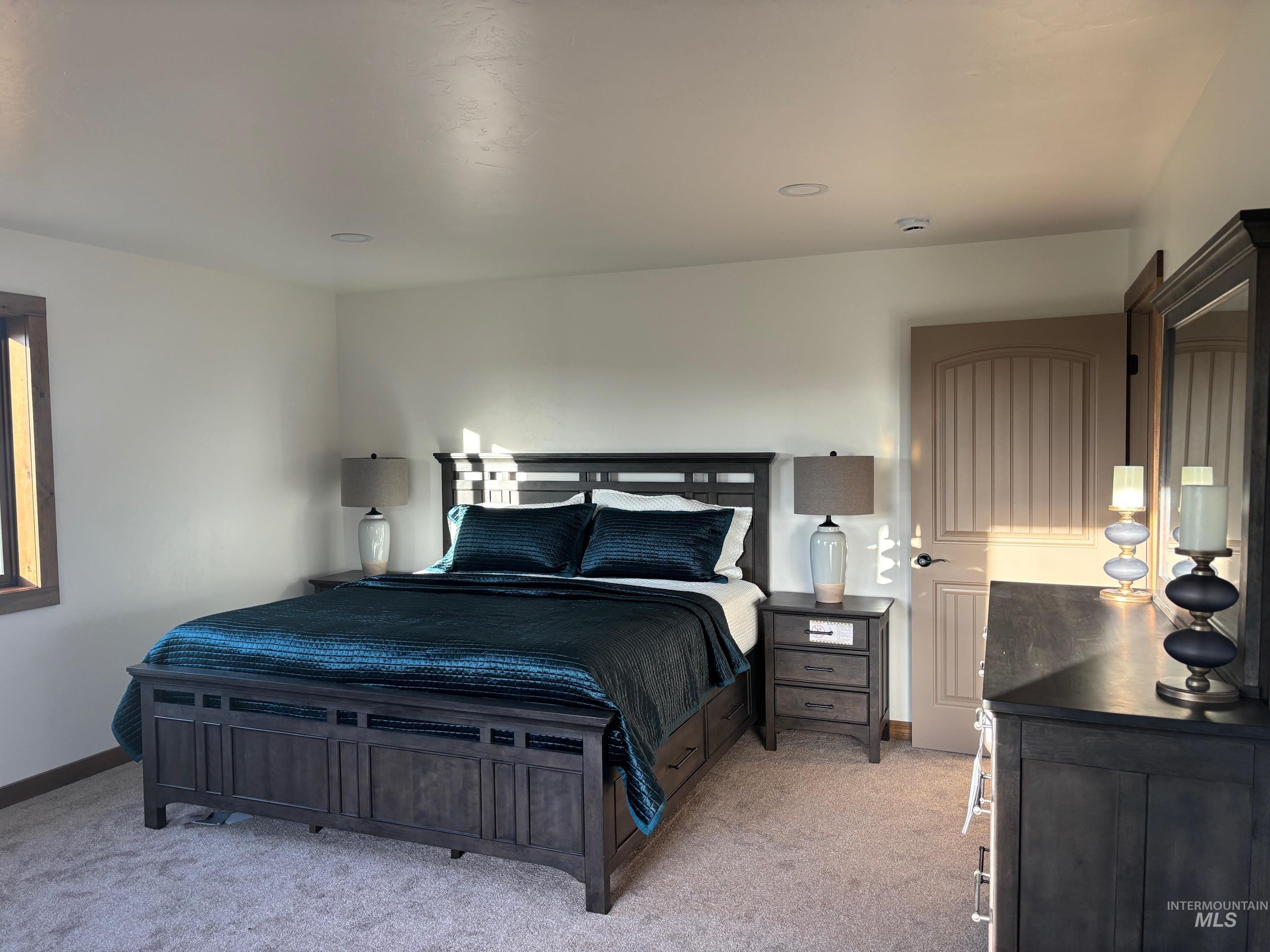 2219 Powers Drive Lewiston, ID 83501 - Photo 11 of 31 Bedroom featuring light colored carpet and baseboards