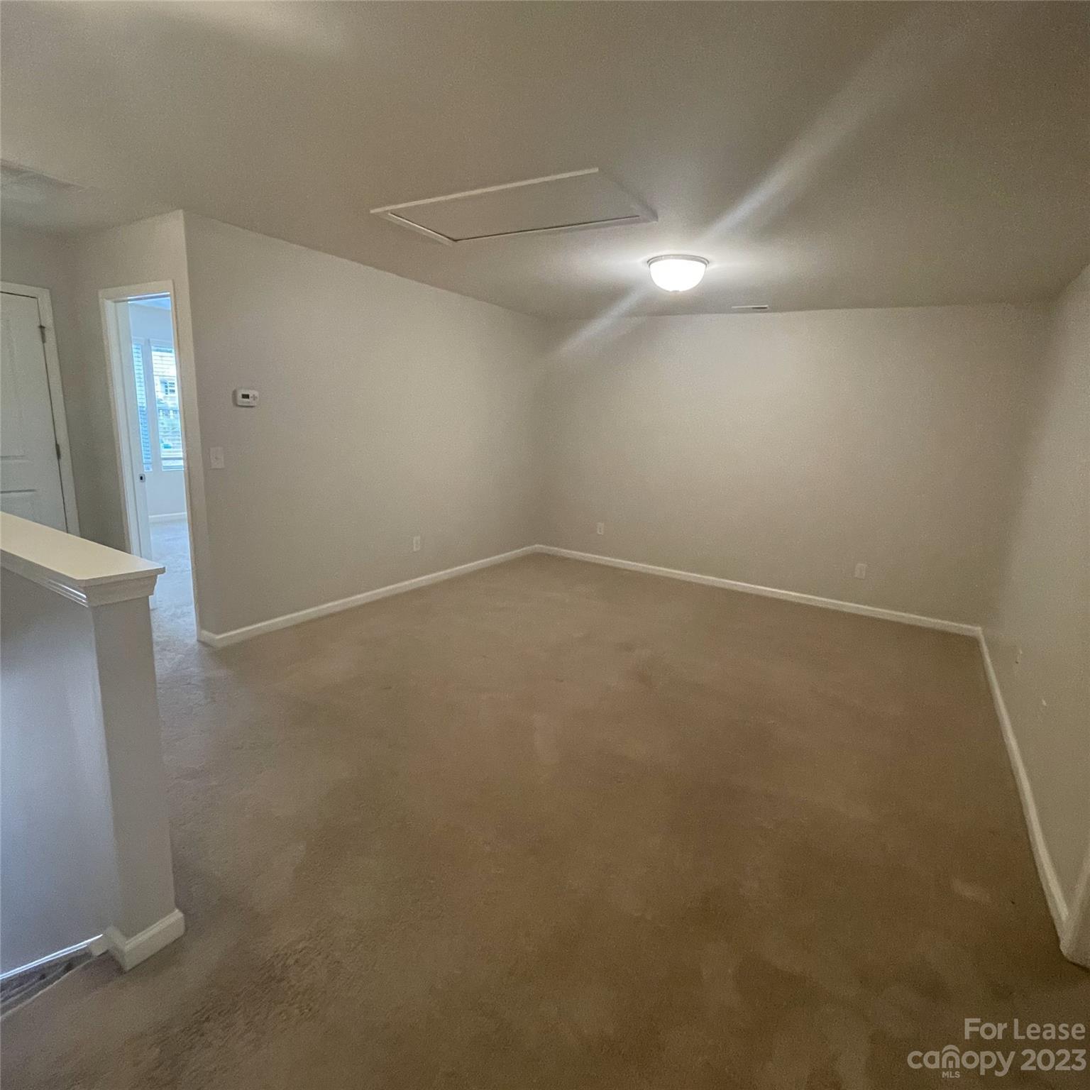 3144 Graceland Circle Pineville, NC 28134 - Photo 21 of 24 an empty room with staircase and white walls