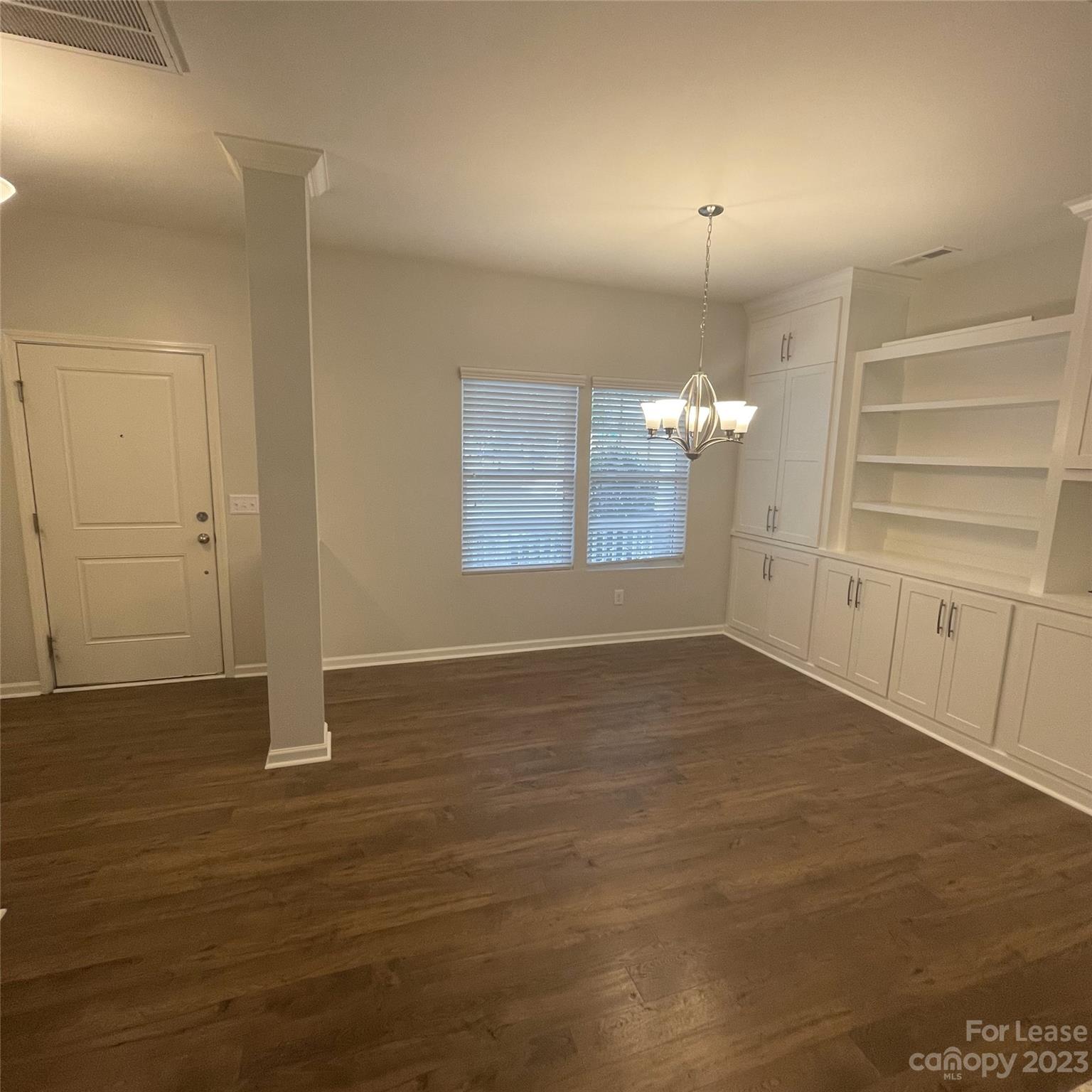 3144 Graceland Circle Pineville, NC 28134 - Photo 4 of 24 an empty room with wooden floor and window