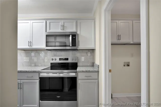a view of room with cabinets