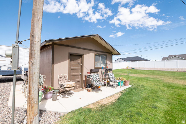 855 East 300 N Street Beaver, UT 84713 - Photo 12 of 44 Detached shed with a brown exterior and a gabled roof