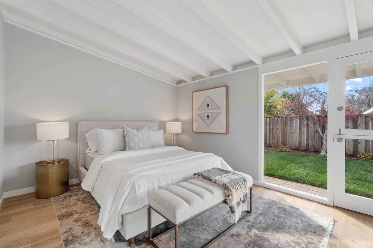 238 Hamilton Avenue Mountain View, CA 94043 - Photo 11 of 18 a bedroom with a bed and wooden floor