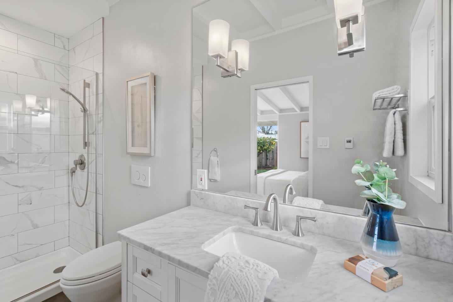 238 Hamilton Avenue Mountain View, CA 94043 - Photo 15 of 18 a bathroom with a granite countertop sink a toilet and shower